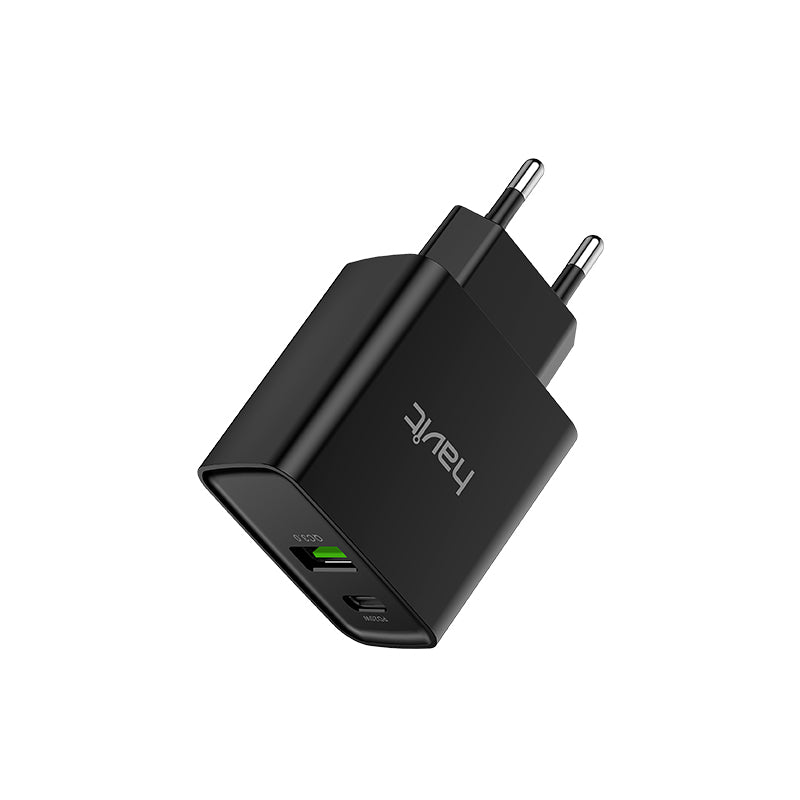 Sort vægoplader med USB-porte.